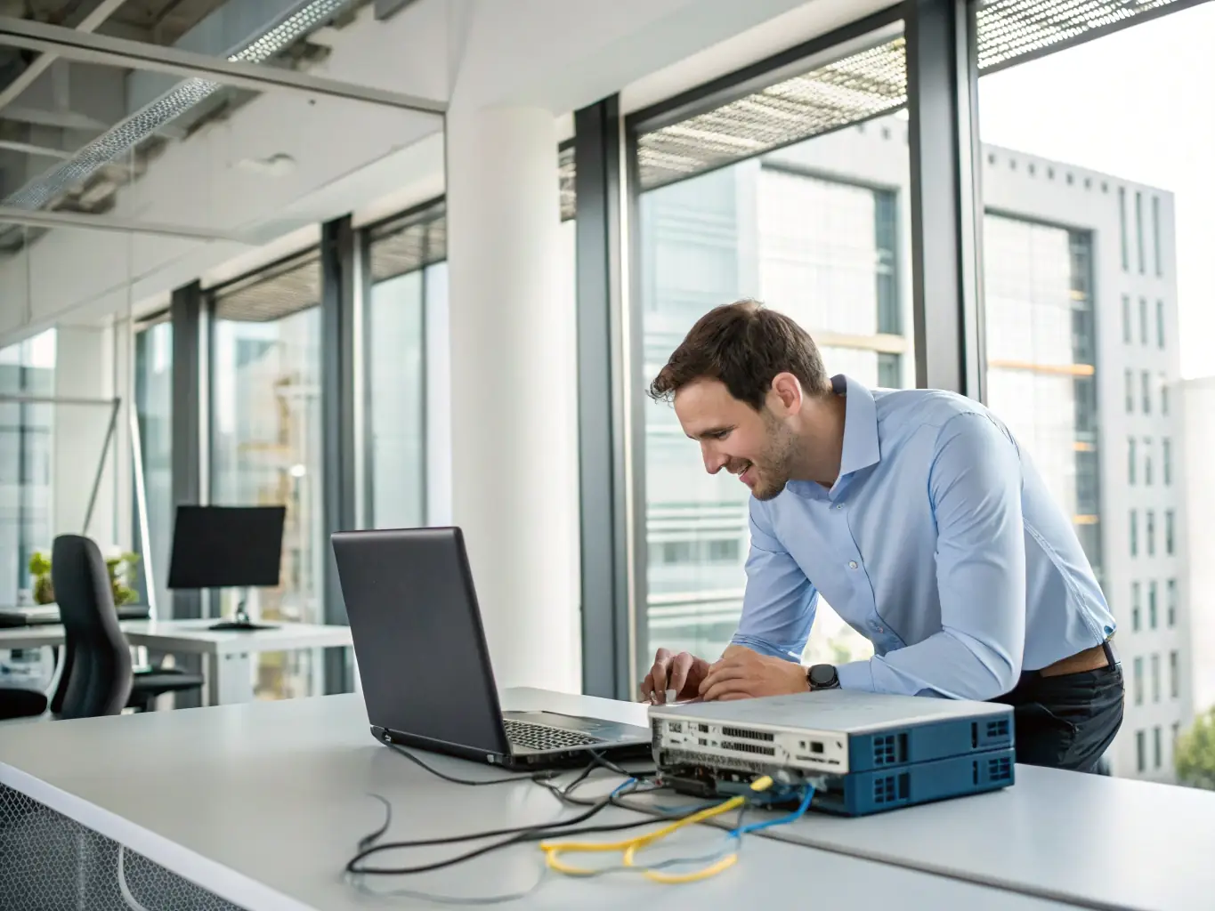 An image showing a technician configuring network equipment in a modern office environment, symbolizing Kumar Hi-Tech Computers' IT solutions.